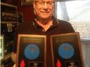 Ken, N2SQW, proudly holds his CW and Phone (Hudson Division Low Power Unlimited) plaques from the ARRL International DX Contest.